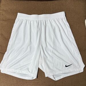 Men’s thin, white Nike dry fit shorts. Labeled as XL but fit more like L. Great.